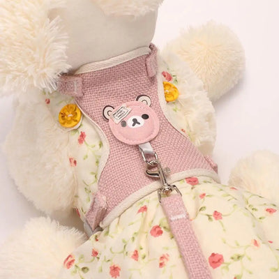 Aviour adjustable undershirt harness for pets in pink with a cute bear design and floral dress on plush toy