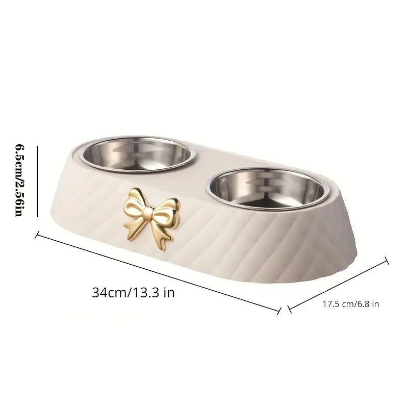 Aviour double stainless steel pet bowl with beige base and gold bow decoration for feeding pets
