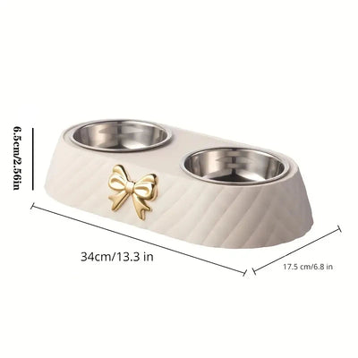 Aviour double stainless steel pet bowl with beige base and gold bow decoration for feeding pets