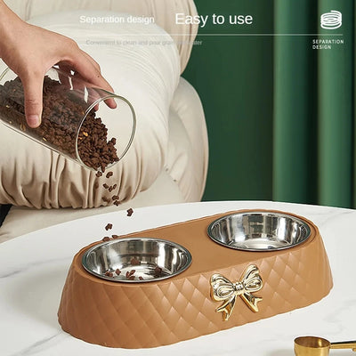 Aviour double stainless steel pet bowl with brown quilted base and gold bow decoration for feeding pets