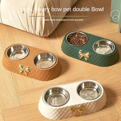 Aviour double stainless steel pet bowl with quilted base and gold bow in brown, green, and white colors