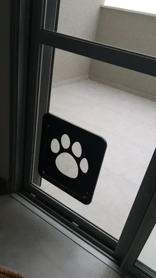 Aviour lockable pet door for windows with paw print design installed on sliding glass door