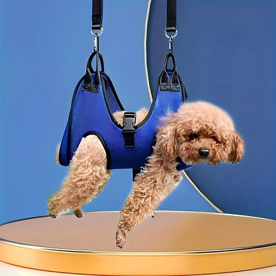 A dog comfortably suspended in blue Aviour safe grooming hammock for pets with secure straps