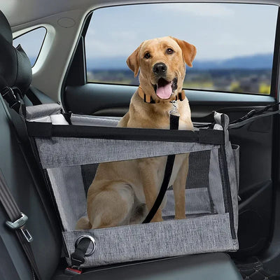 Happy dog sitting in Aviour safe pet seat for car travel with mesh sides and secure straps